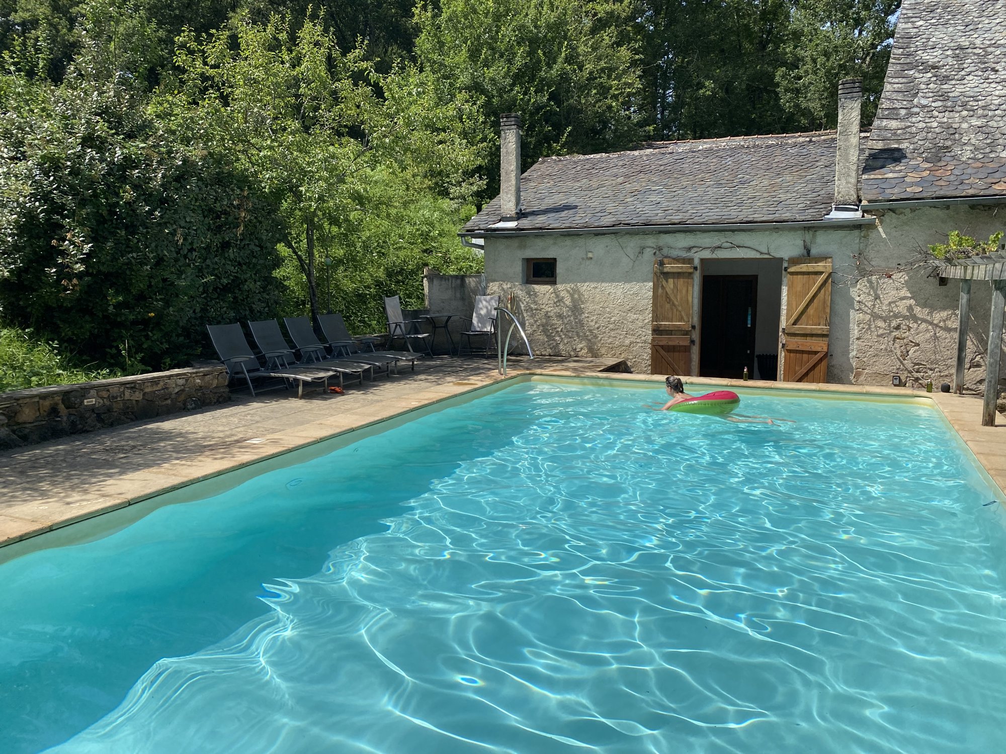 The pool at Saint Blaise with the barn behind